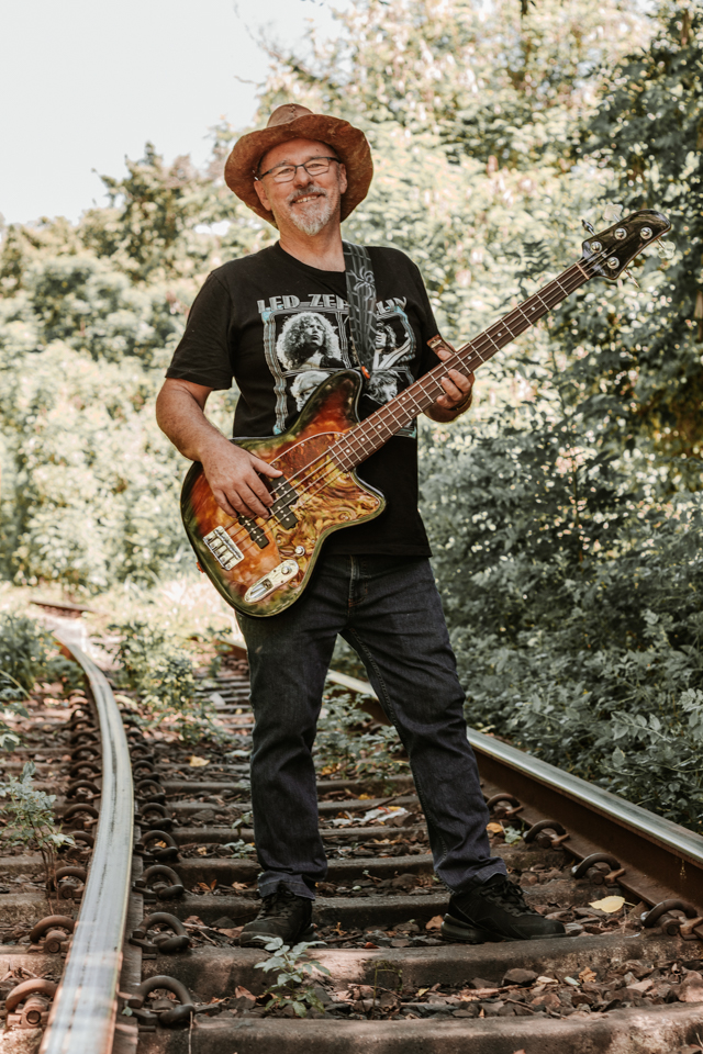 Live wedding band member playing harmonica