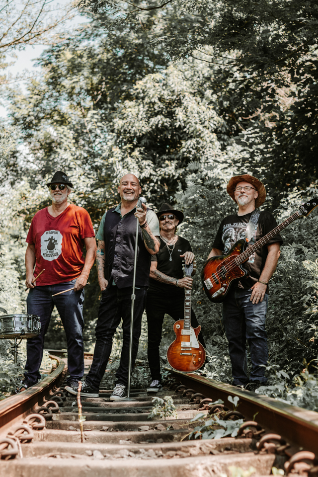 Wedding band group portrait in natural light outdoors